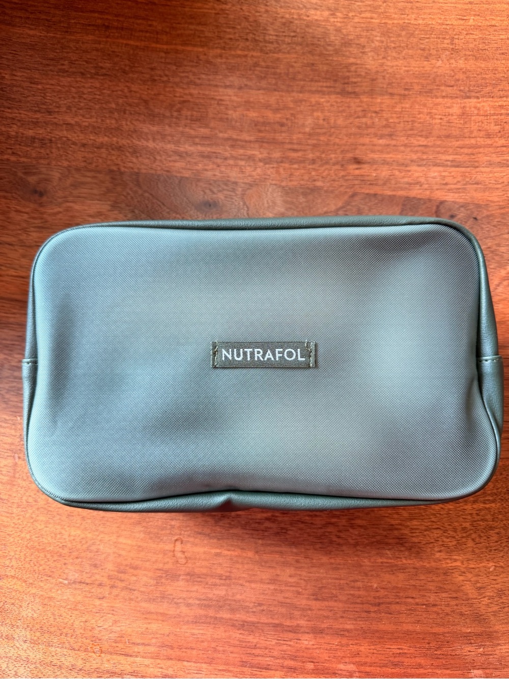 Nutrafol Travel Kit with mini wet brush, mini shampoo conditioner, and pill pack